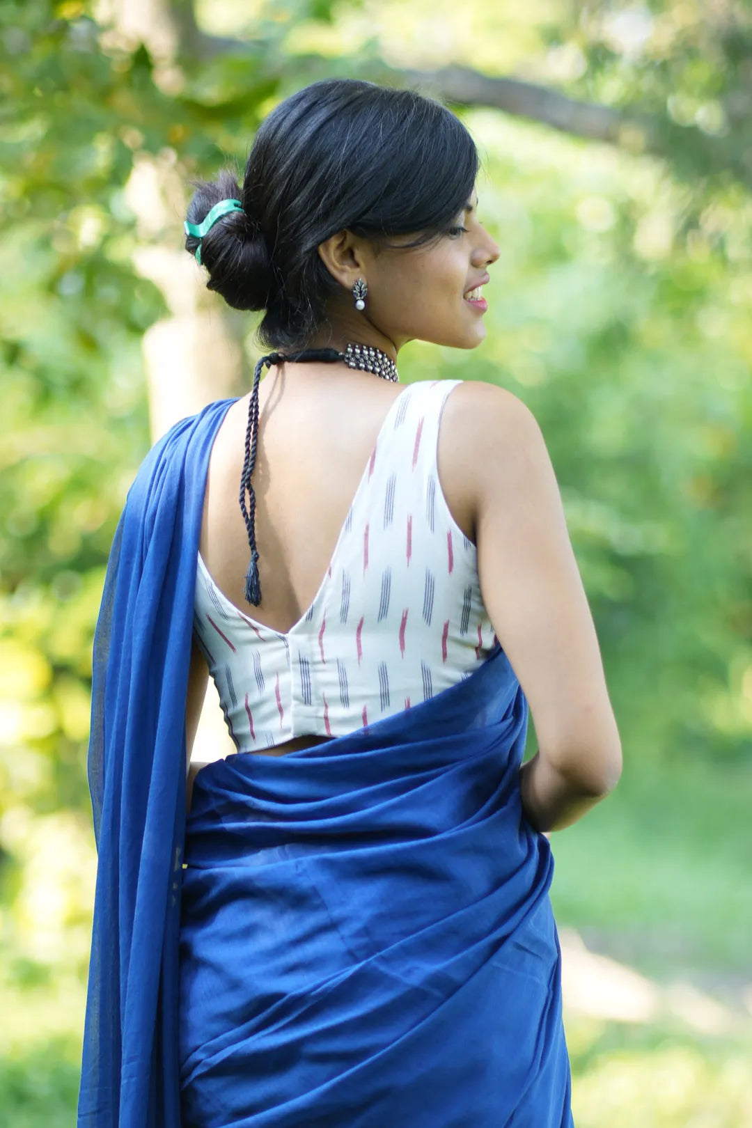 White Ikkat Sleeveless Blouse with intricate designs - I Love Sarees